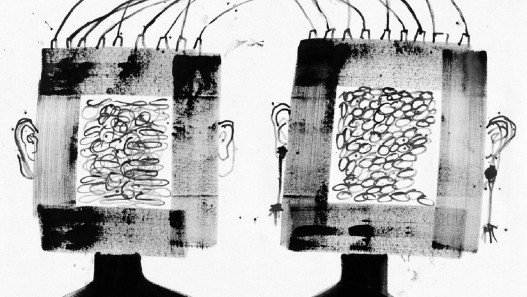 Illustrative image of two square head-shapes emerging from one body and joined at the crown by electric cables 
