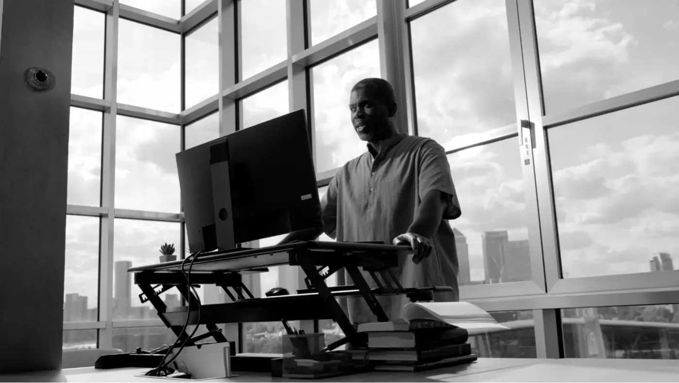 Caleb stand at his computer