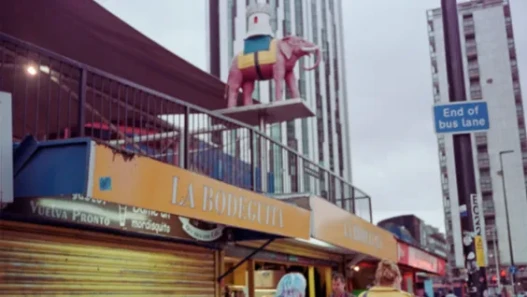 Exterior shot of Elephant & Castle shopping centre, with the statue of the pink elephant.