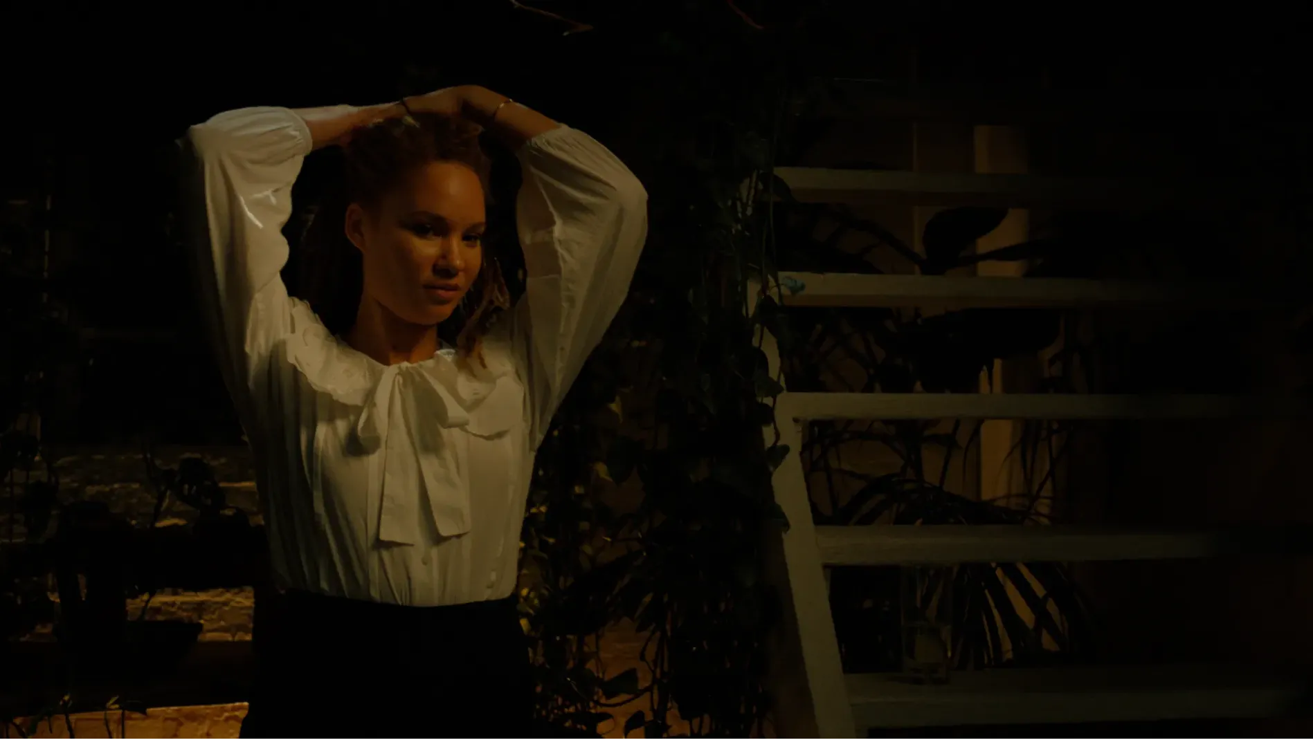 Hannah ties up her hair