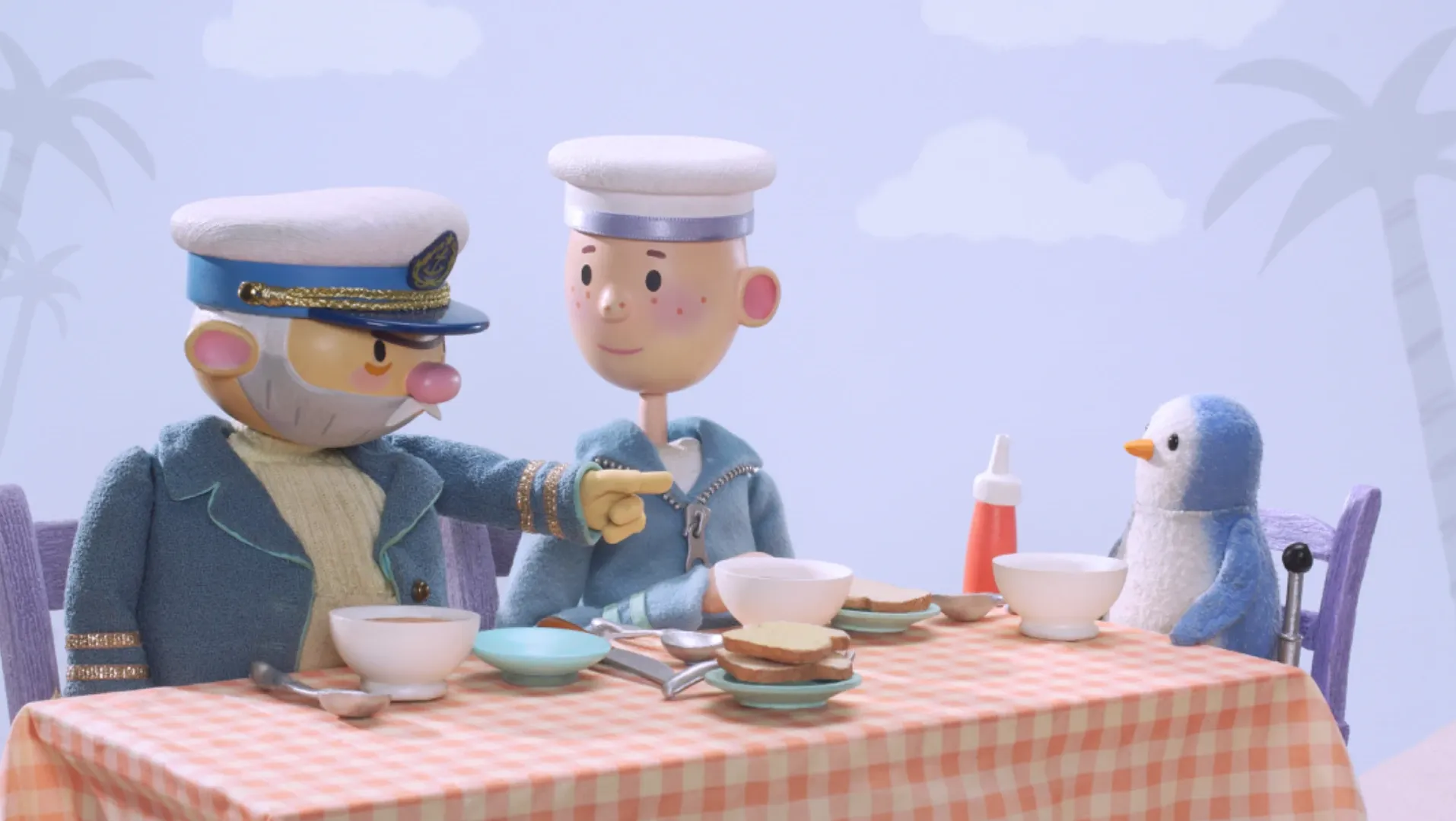 A penguin, a Captain and a boy sit at a dinner table for a meal.