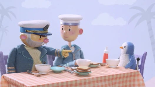 A penguin, a Captain and a boy sit at a dinner table for a meal.