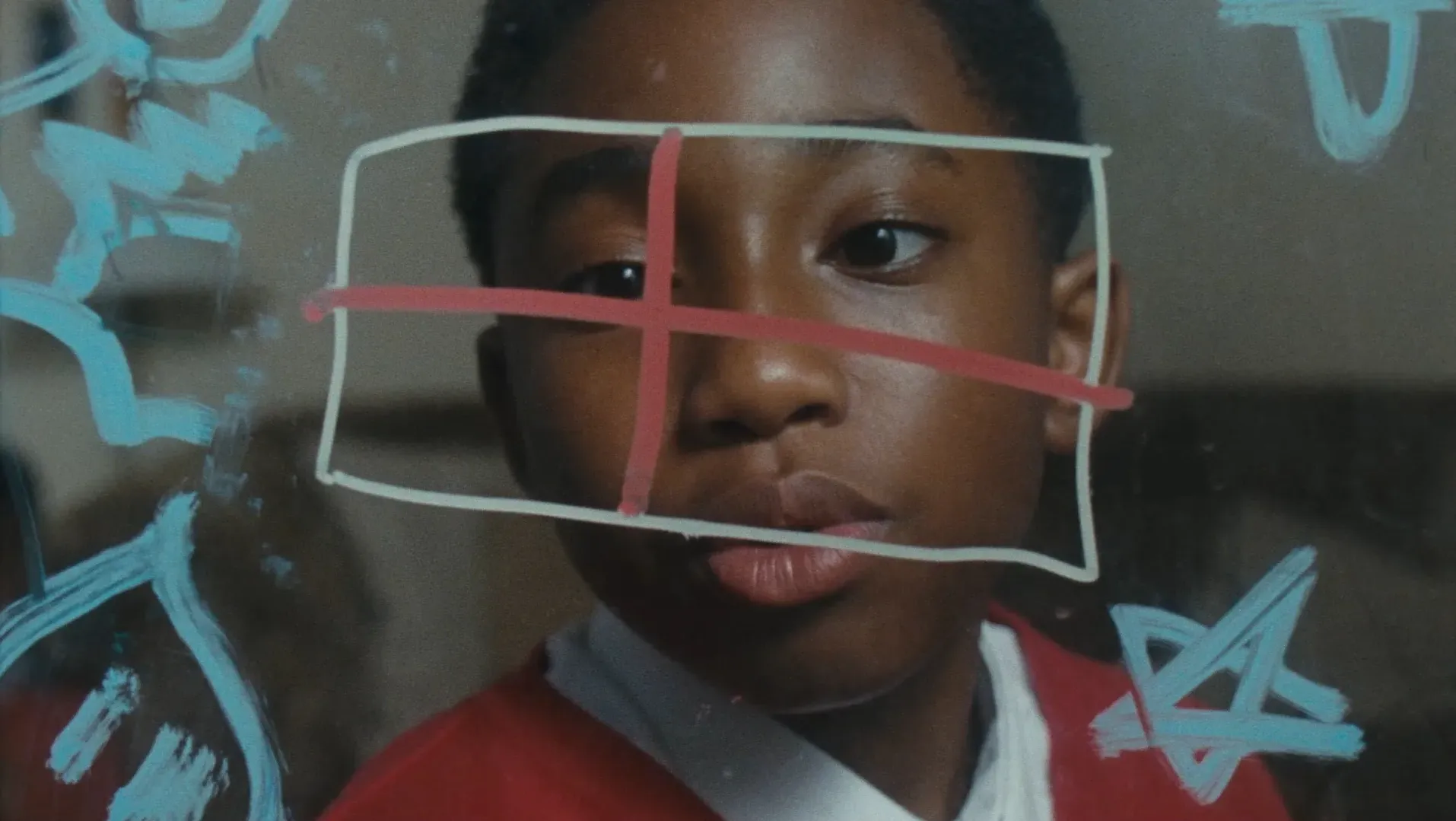 Marvin looks at his drawing on the window