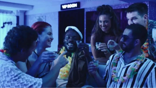 A group of friends celebrating a stag holiday with drinks.