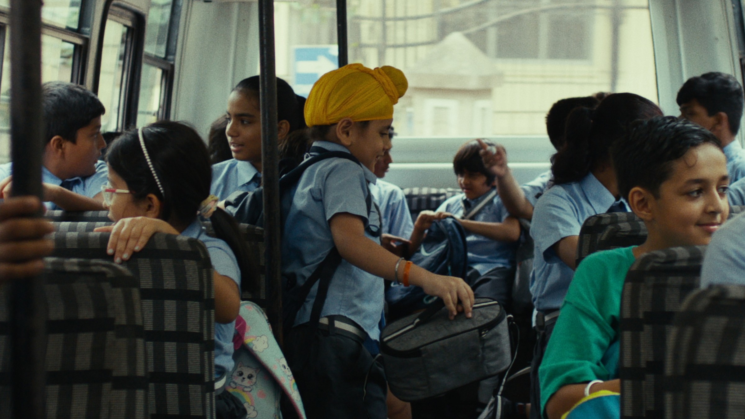 School children seated in a bus