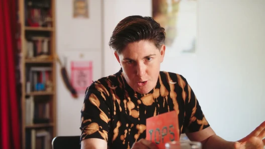 A reality TV presenter speaks to the camera, looking directly into the lens.