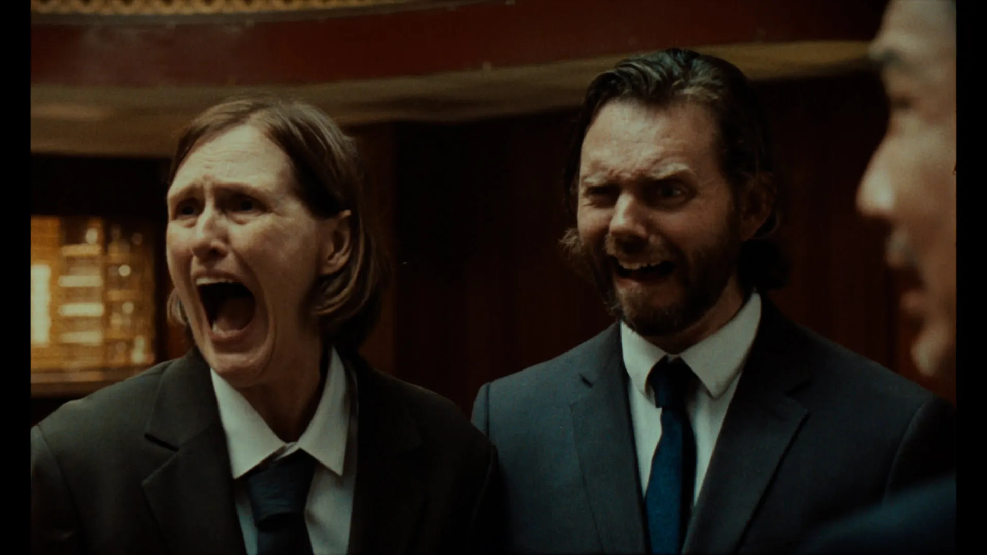 Two smartly dressed characters scream