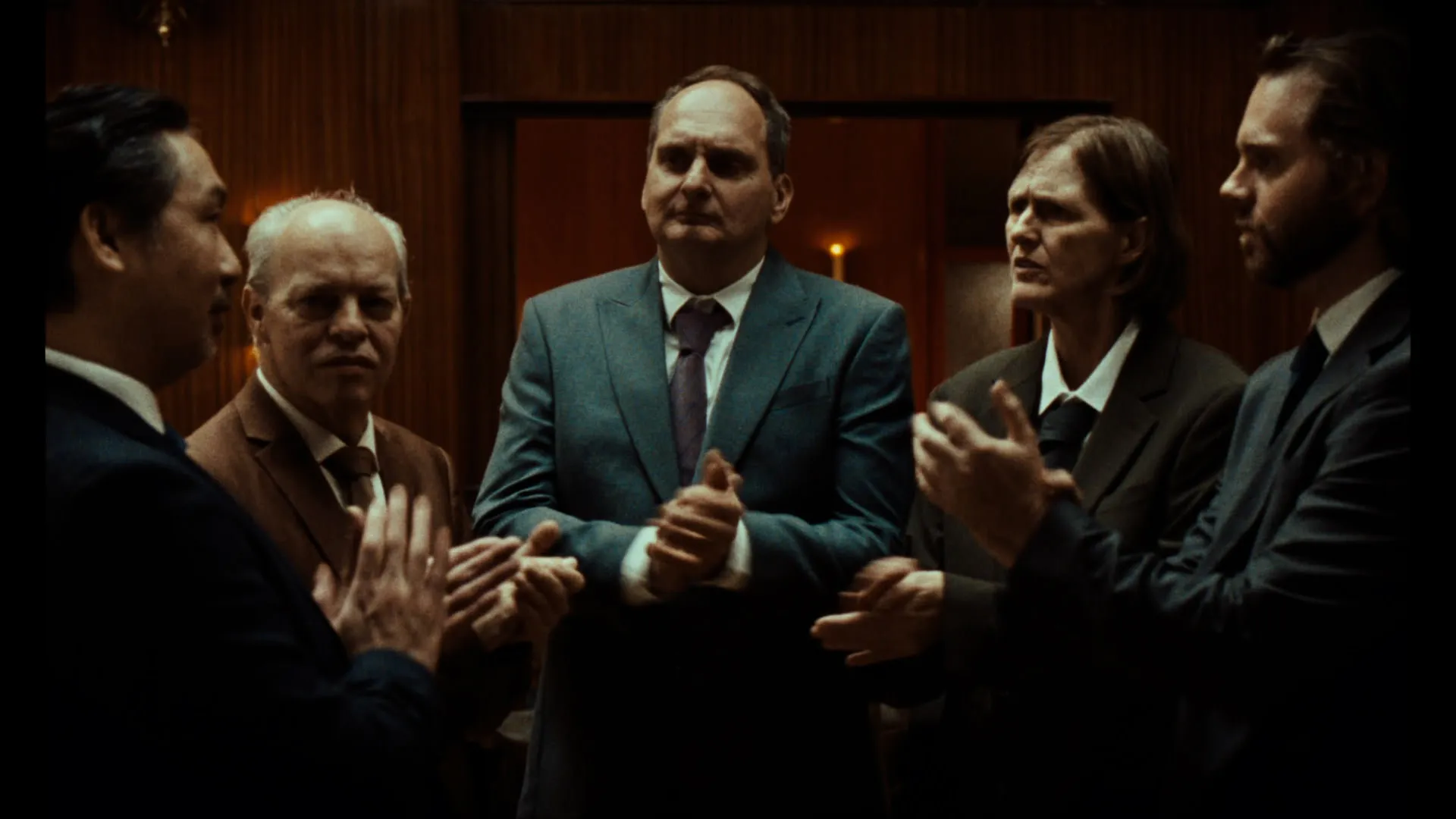 A group of people clap