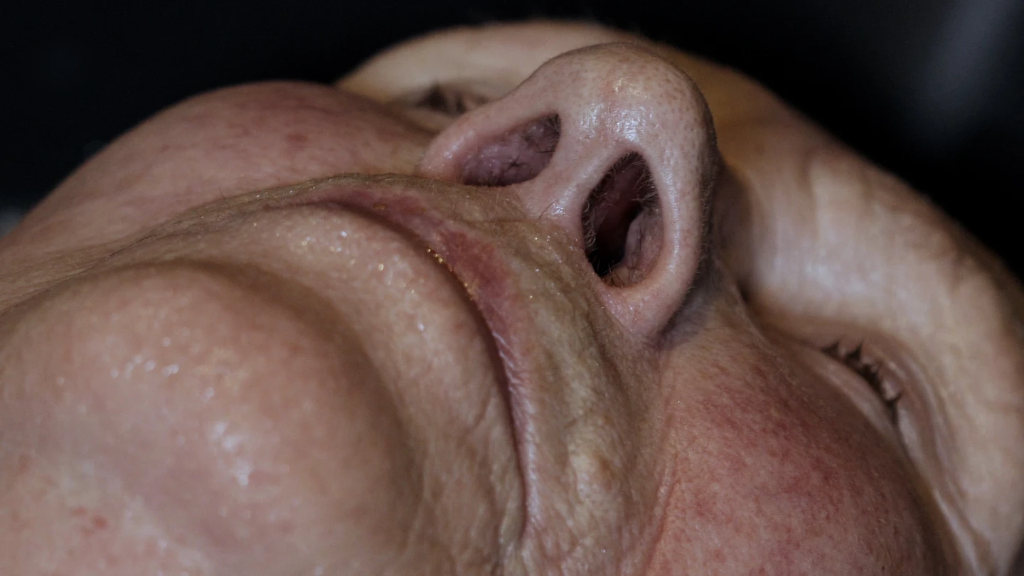 Woman lying down and a close up of her nostrils