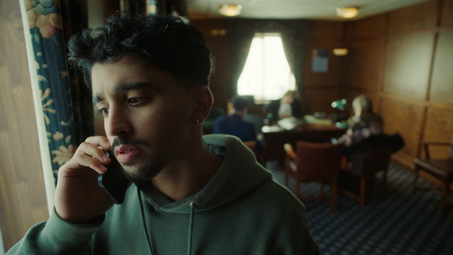 Jamie pick ups the phone at Funeral Director