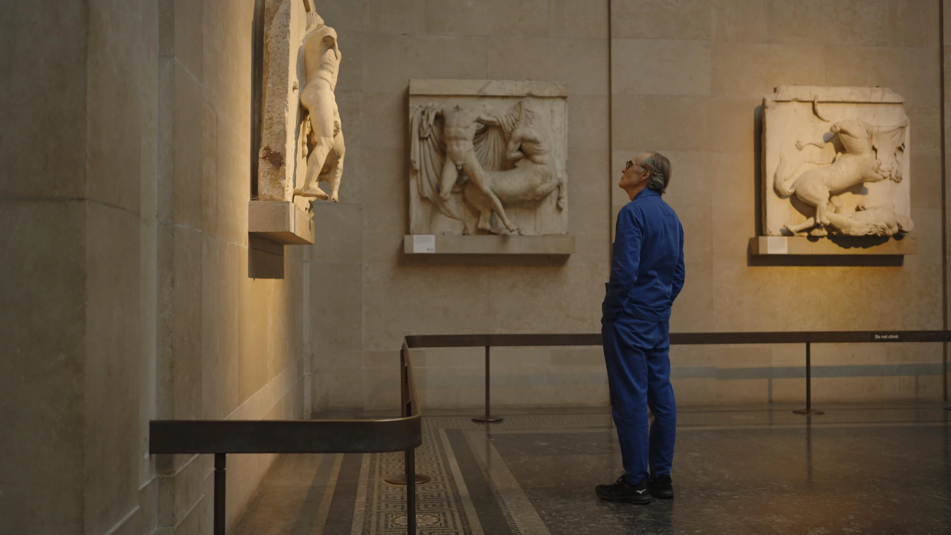 Director David Nicholas Wilkinson looking at the Parthenon Marbles in the British Museum in 2024.