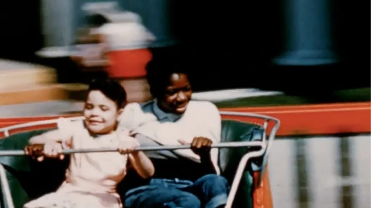 Two young people on a carnival ride.
