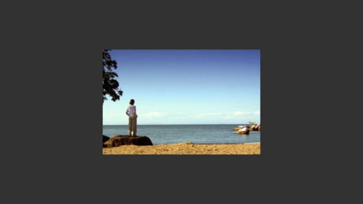 A woman looking out over a lake
