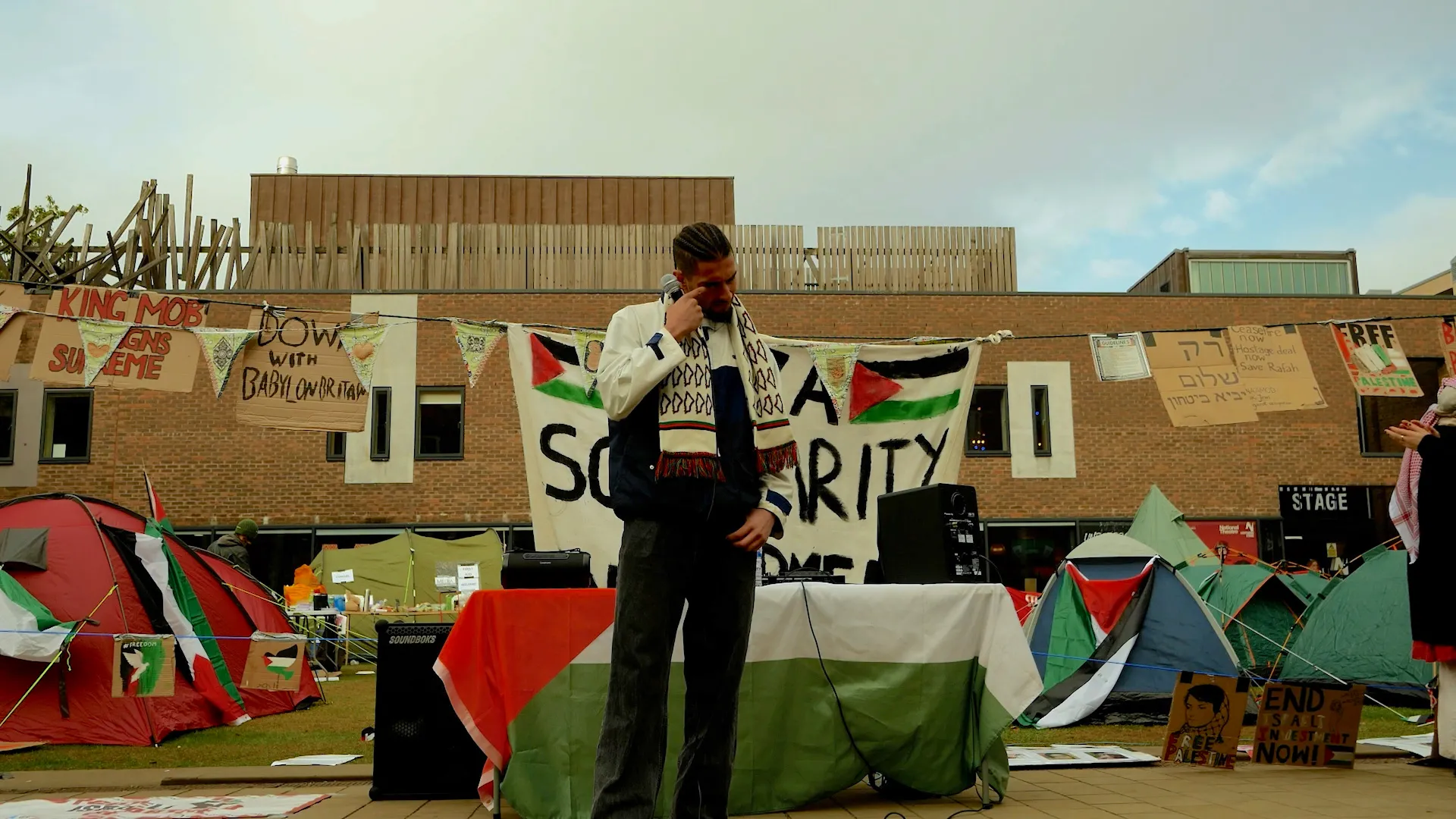 Palestinian student delivering speech at Newcastle University encampment in May 2024