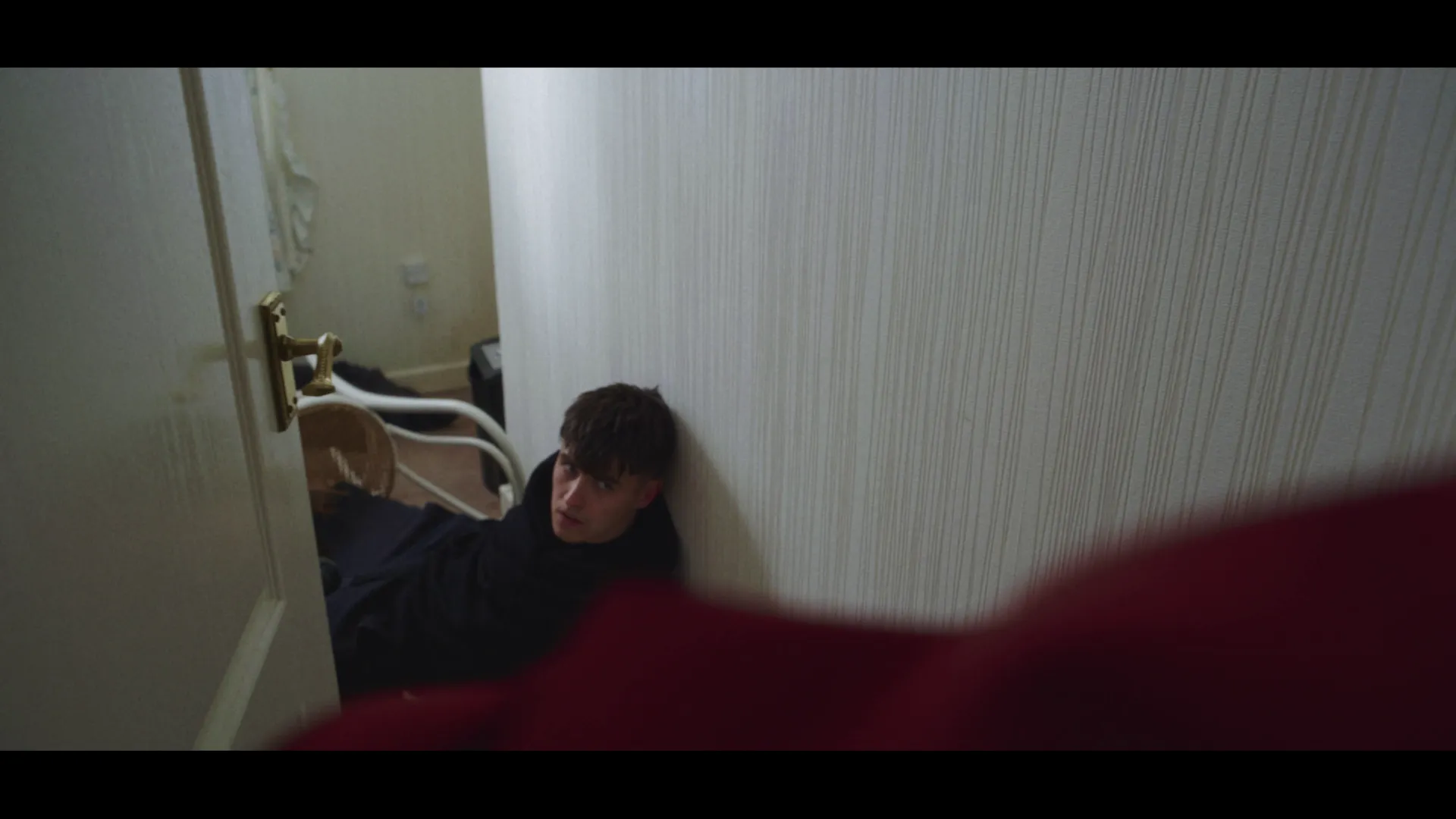 Robert confronting the burglar.