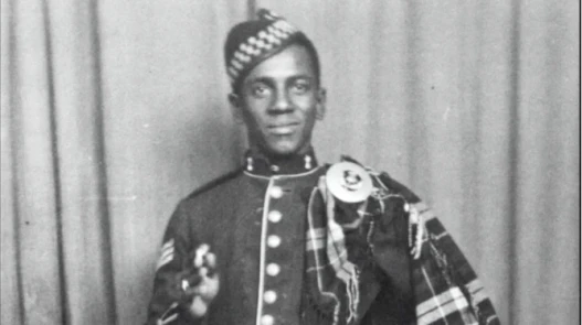 John Stephen Mingo in full Scots regalia