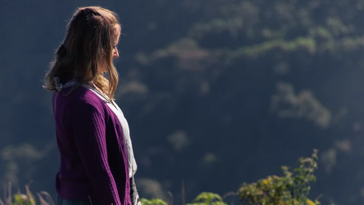 actress walking toward the city- scene of the film