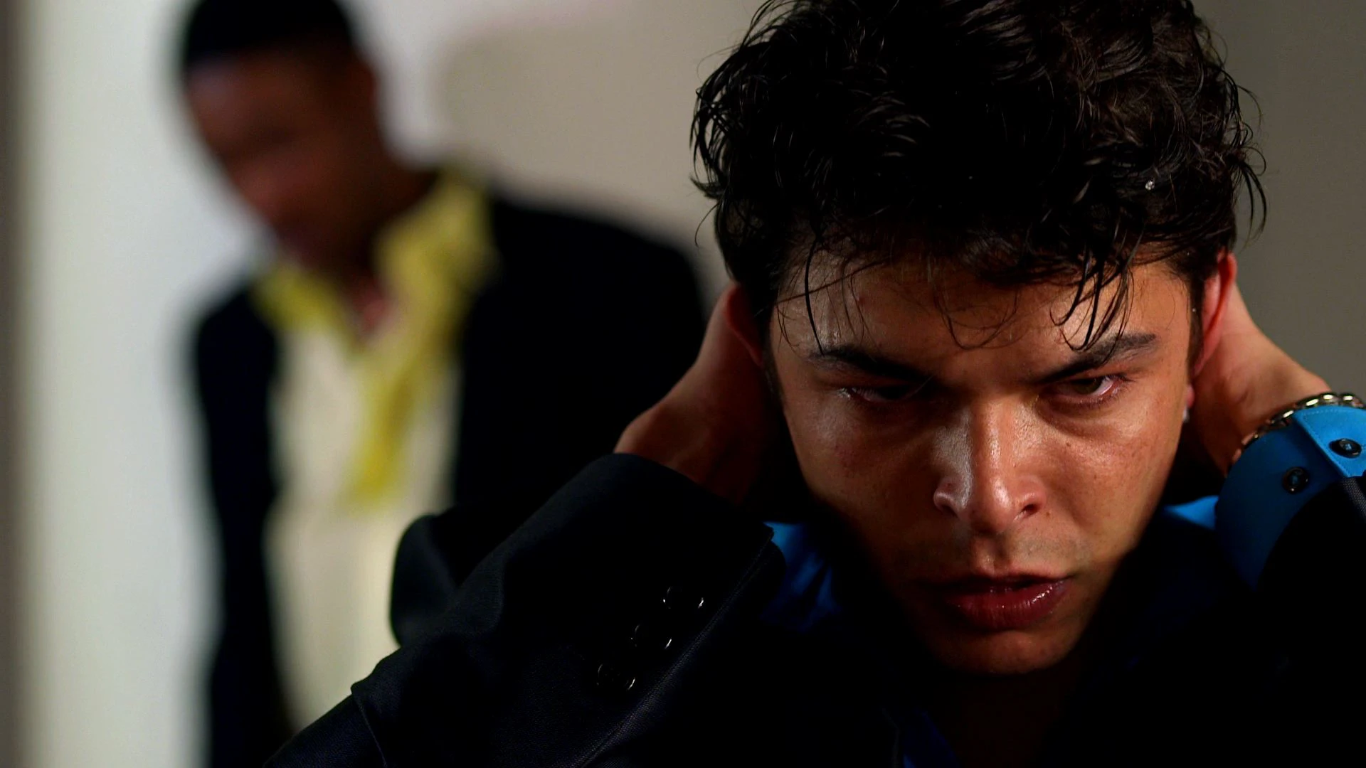 Dave, played by Charlie Macgechan, is shown in an urban setting with an intense facial expression.