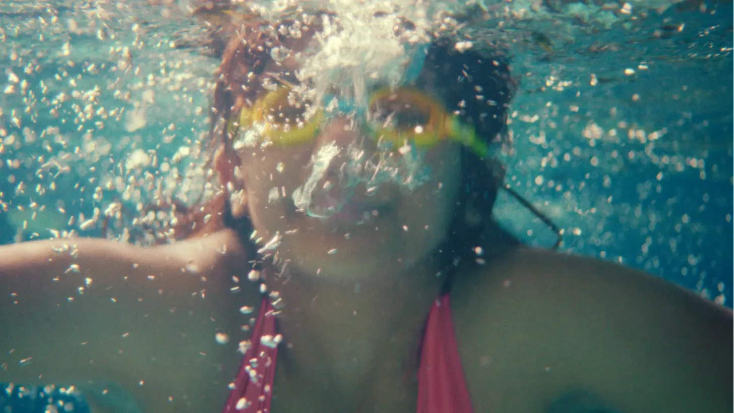 Underwater image of a young girl swimming