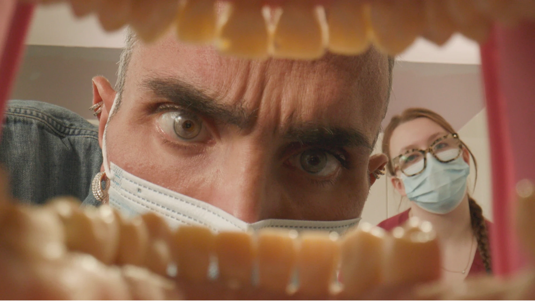 A view of a dentist from inside a mouth