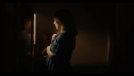 Pregnant woman in a confessional