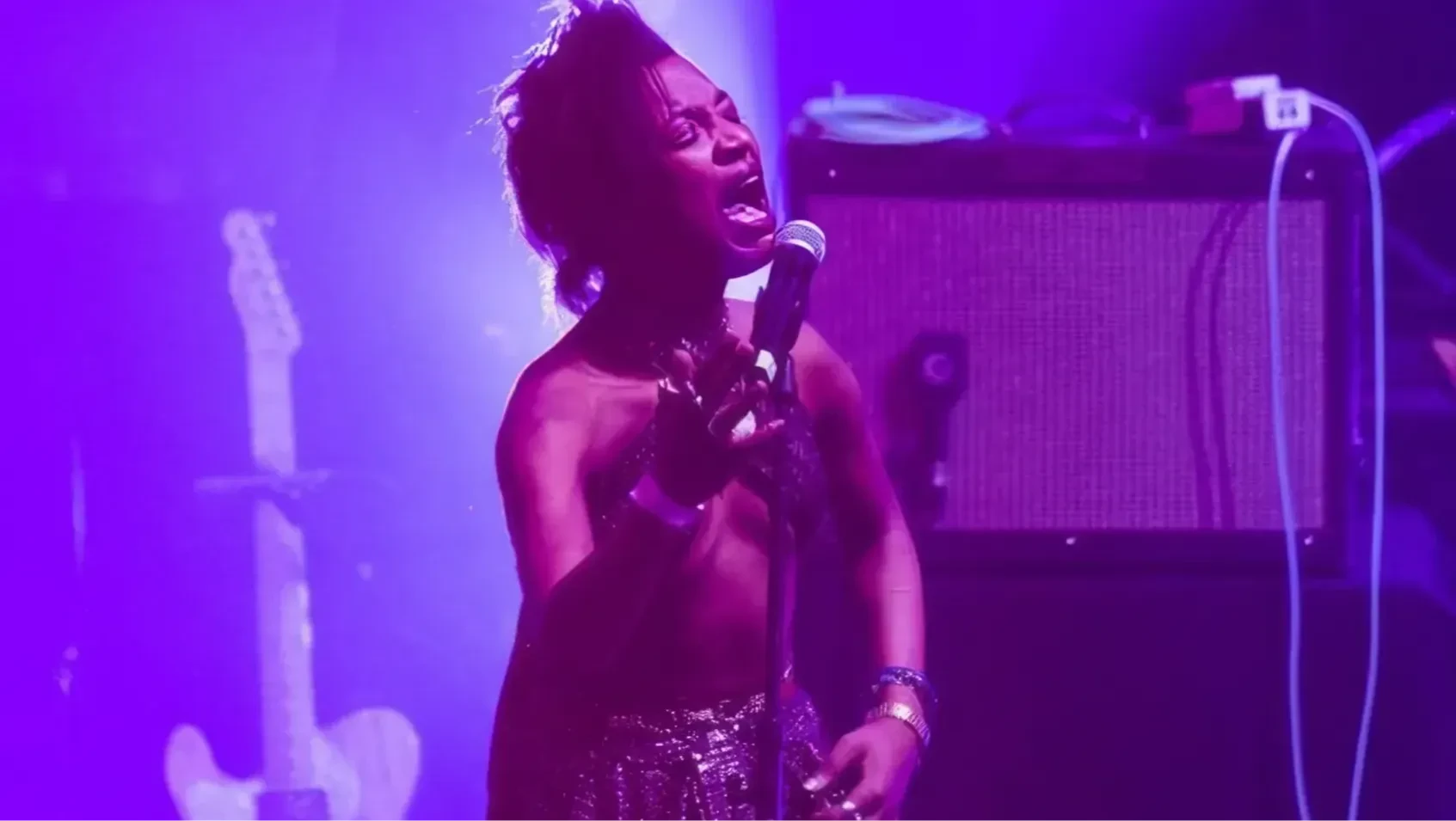 A woman singing into a microphone