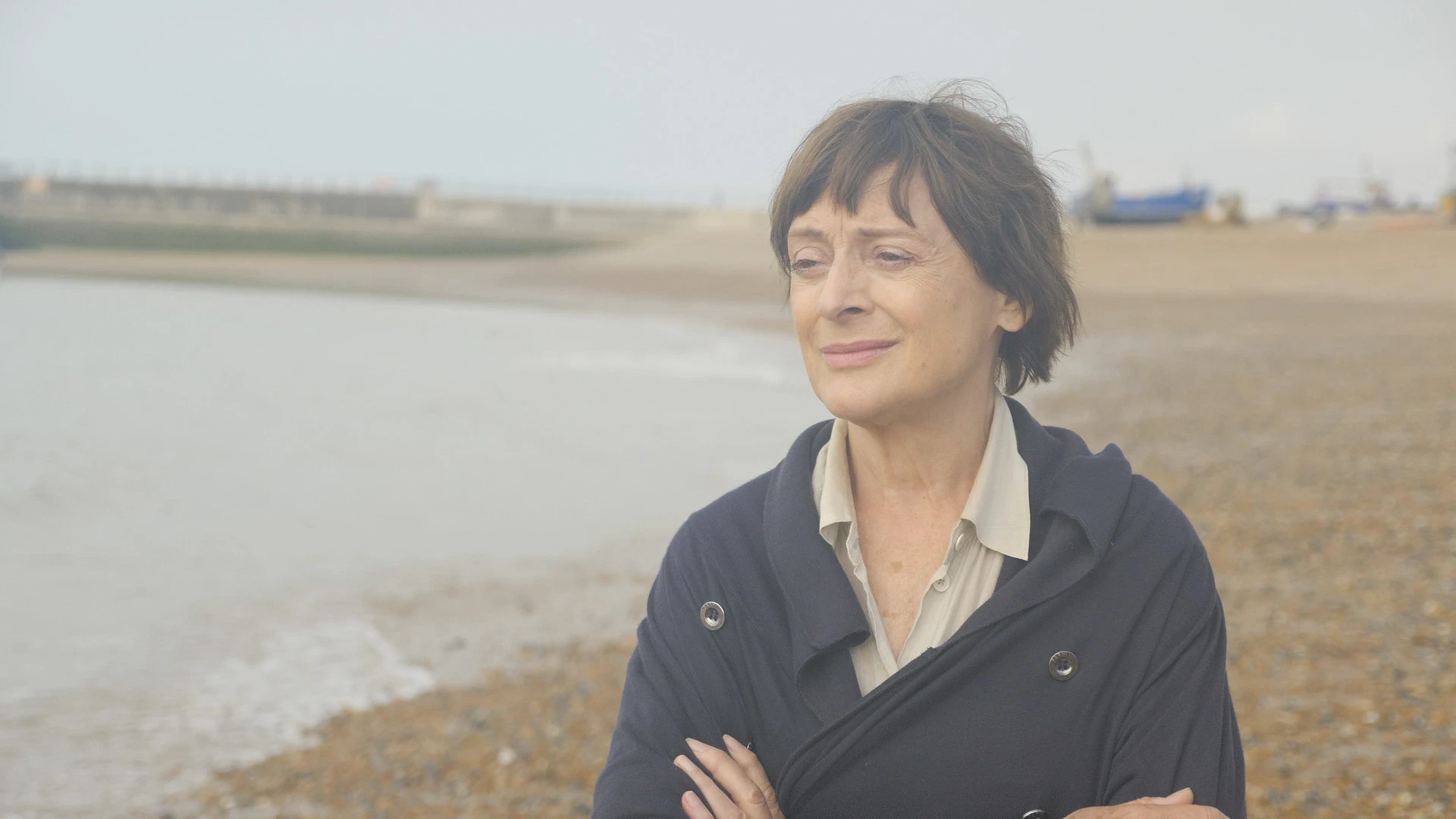 Rita contemplates her life while walking on the beach in East Sussex