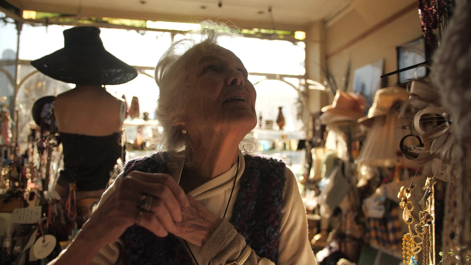 Elke looking above at her shop