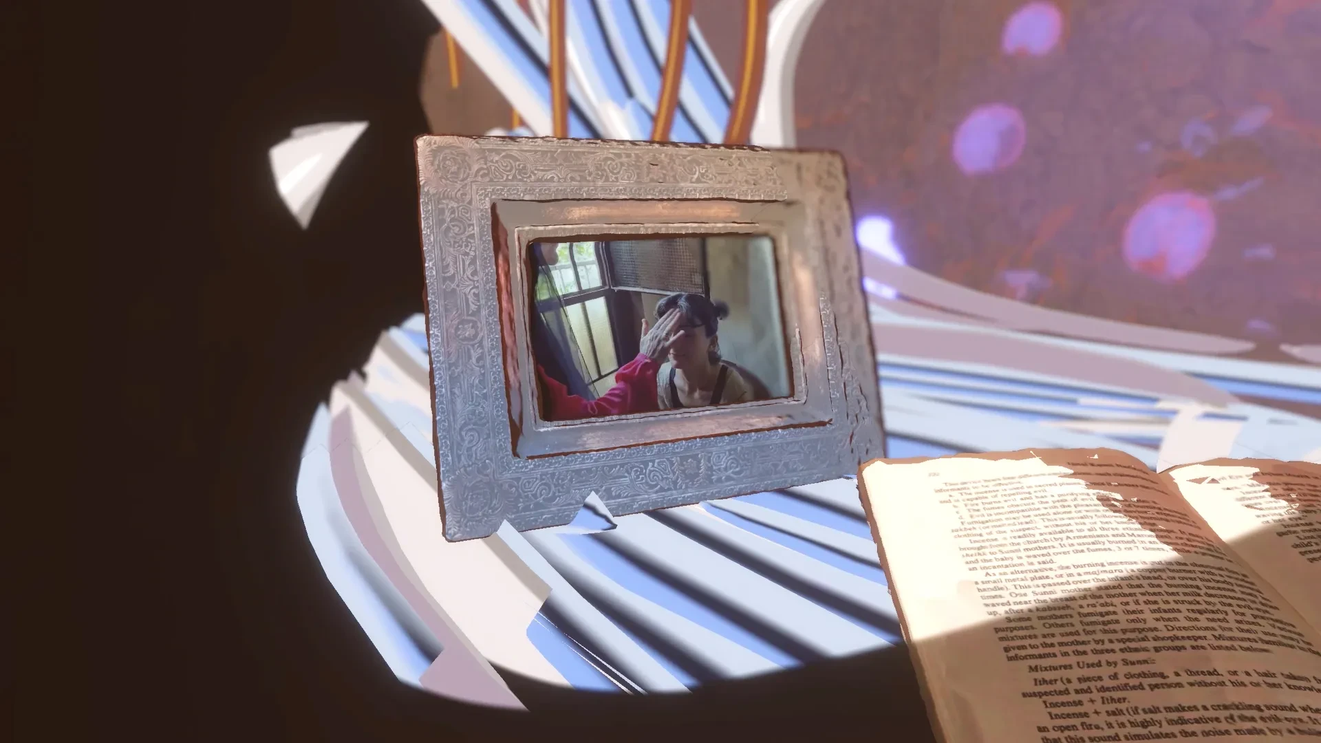 Detail shot of a picture frame lying on a commode, its screen showing someone performing the lead-melting ritual.