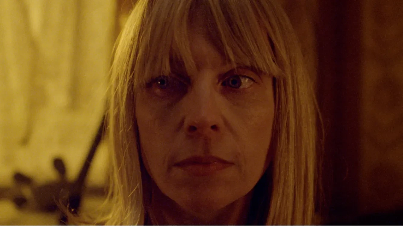 A close up of a blonde woman looking concerned