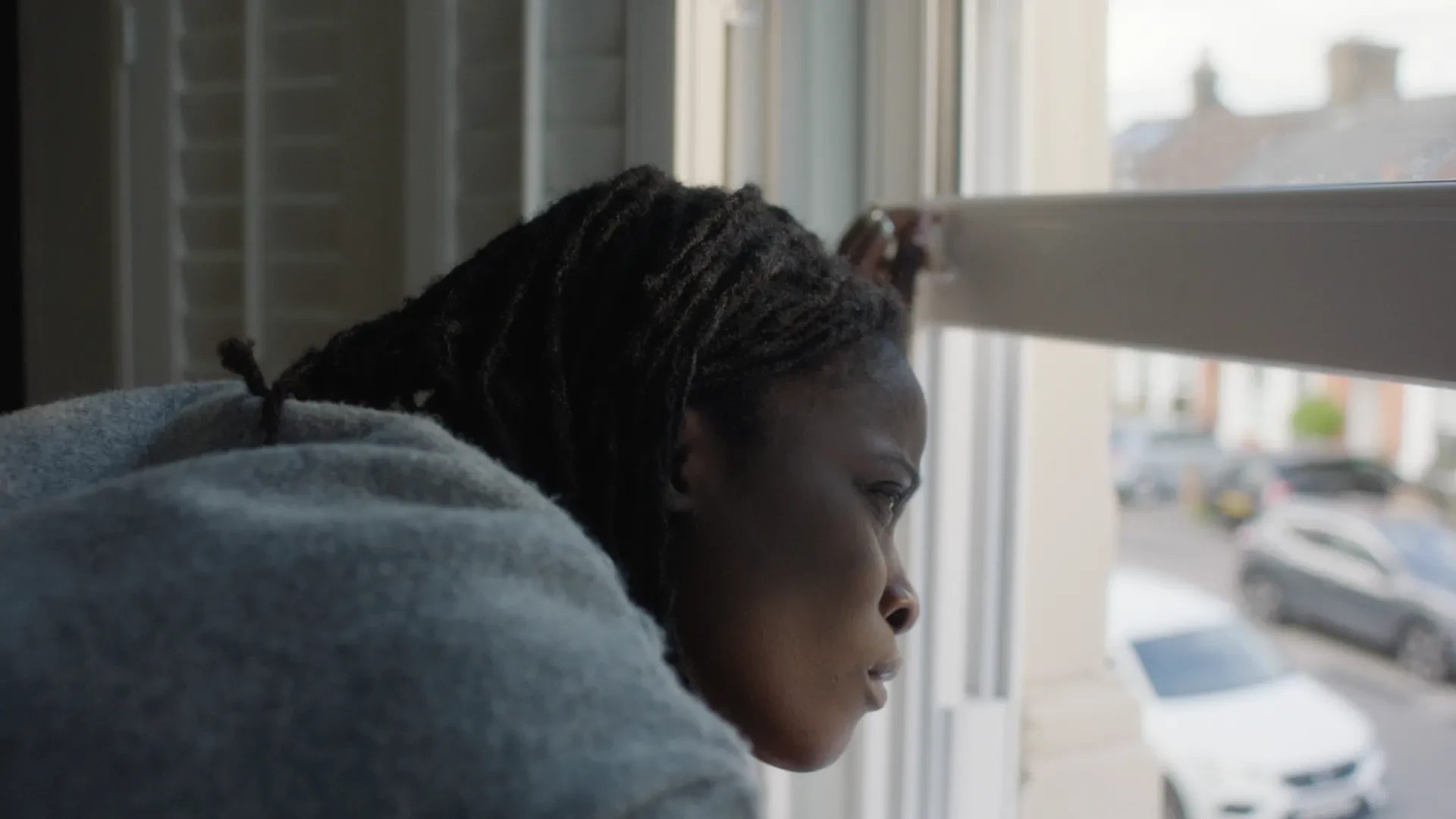 Olara looking out of window