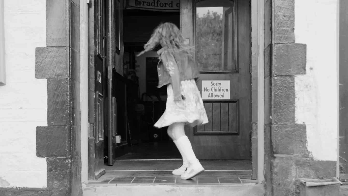 girl in front of pub