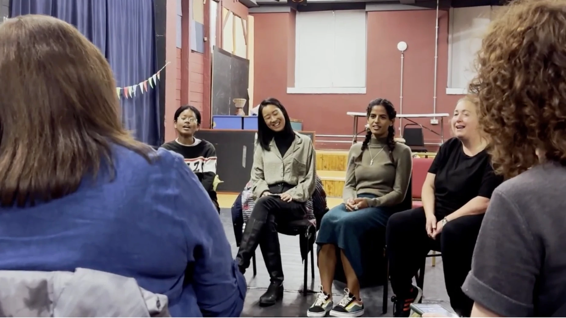 A group of women sing together