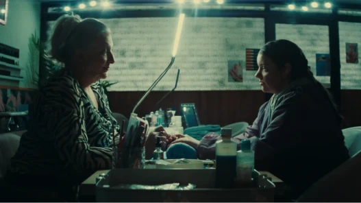 Donna & Saskia sit opposite eachother in a nail salon.