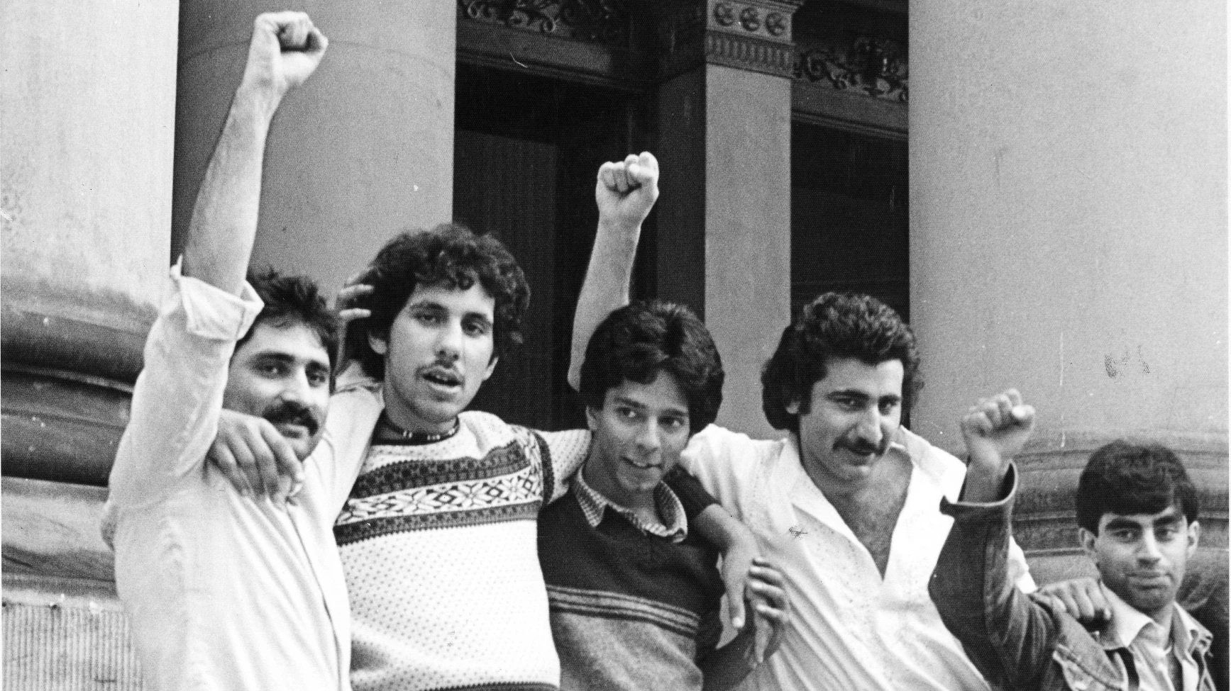 Victory for the Bradford 12 outside Leeds Crown Court in 1982 who defended their community against racist attacks.