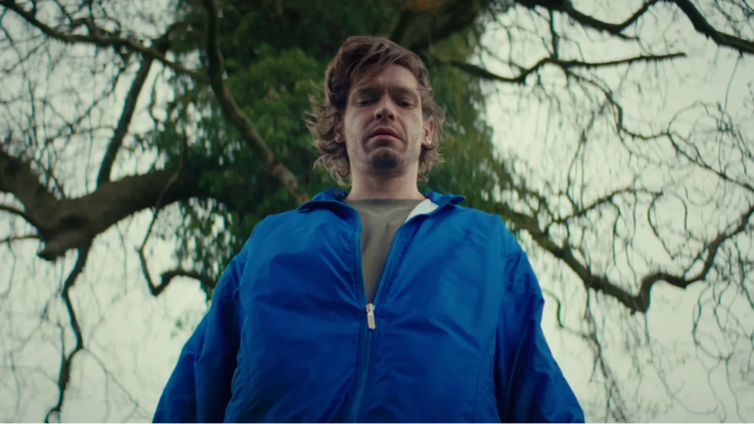 Jay stares down at a bird he has accidentally killed.