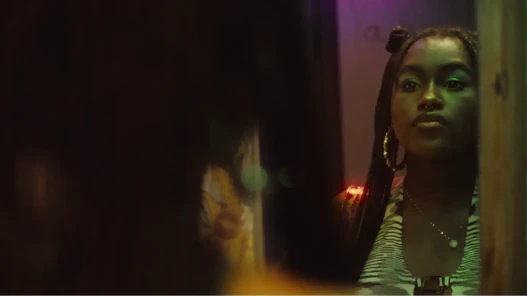 A girl looking at herself in the bathroom mirror