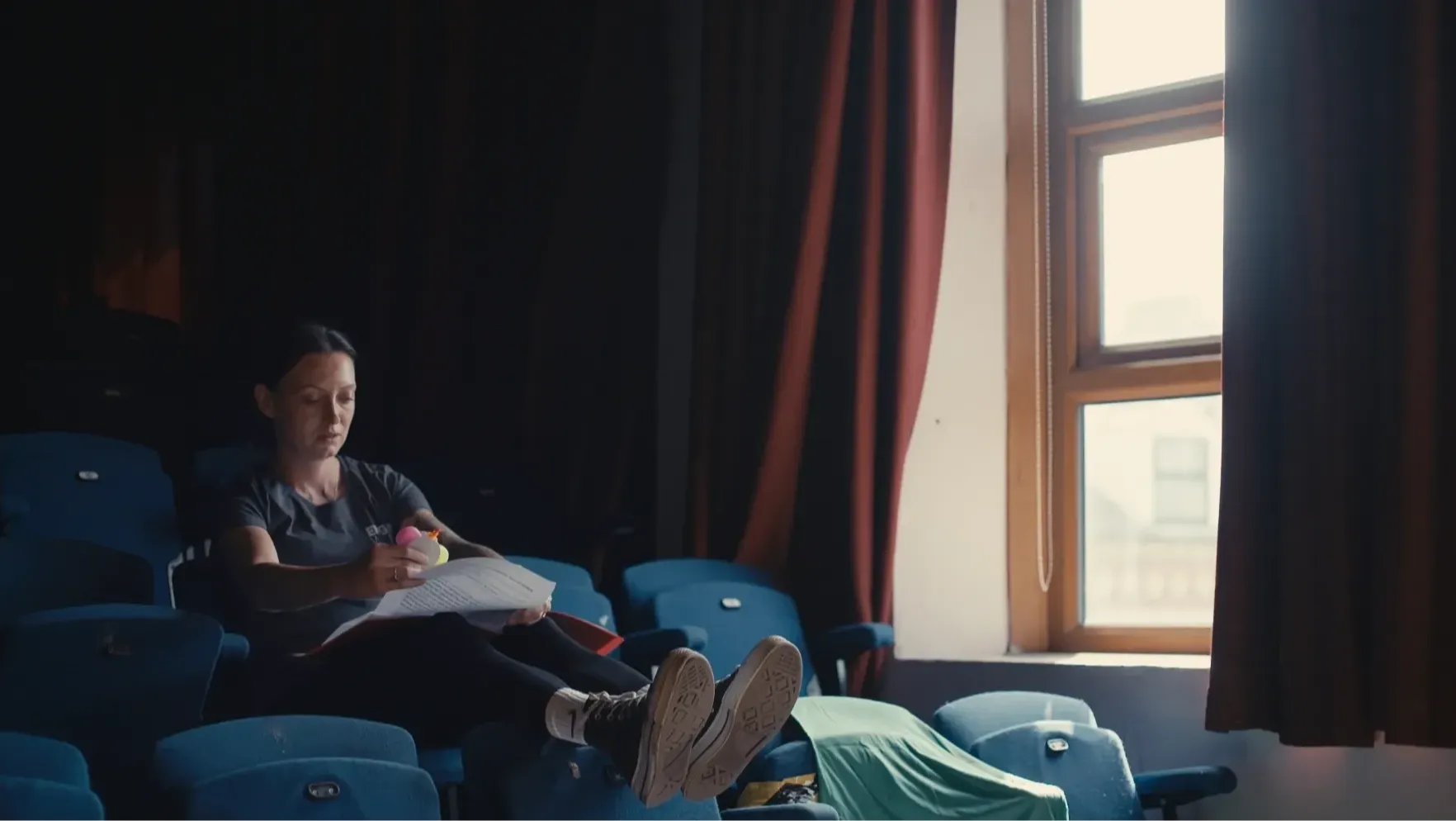 A woman reading through script