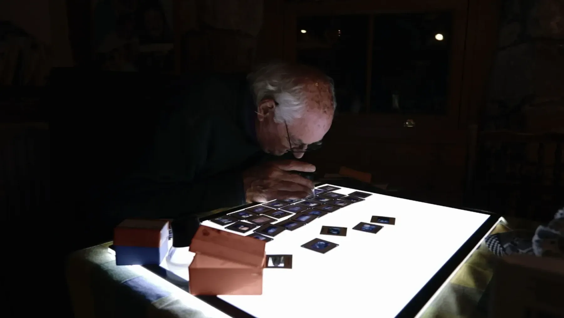 The film director's father, John, studies rediscovered archive images