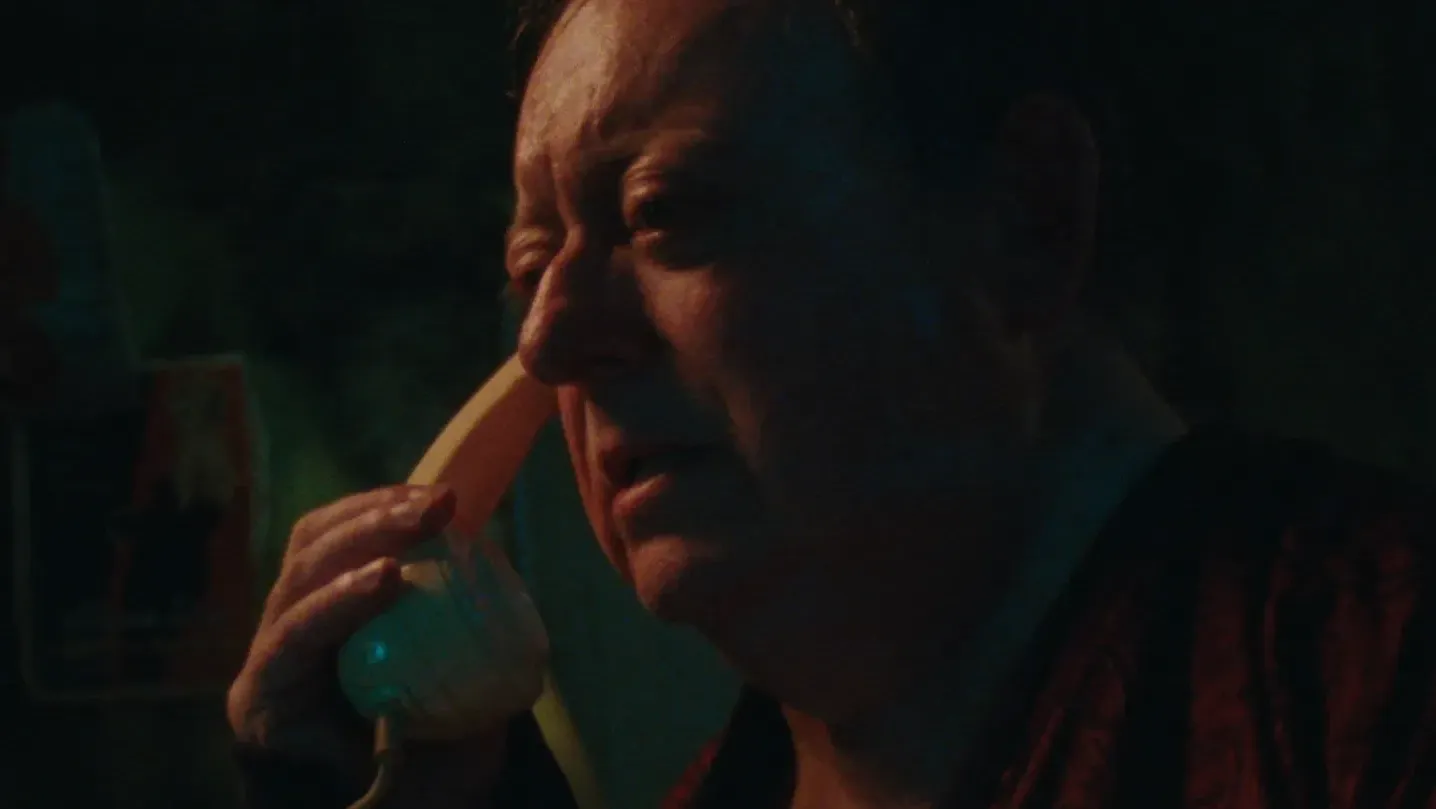 A man holds a phone to his ear