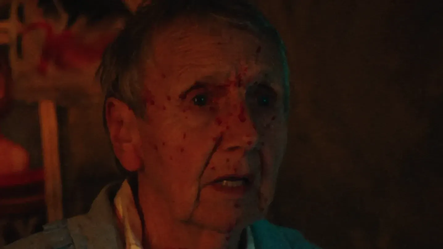 A woman spattered with blood