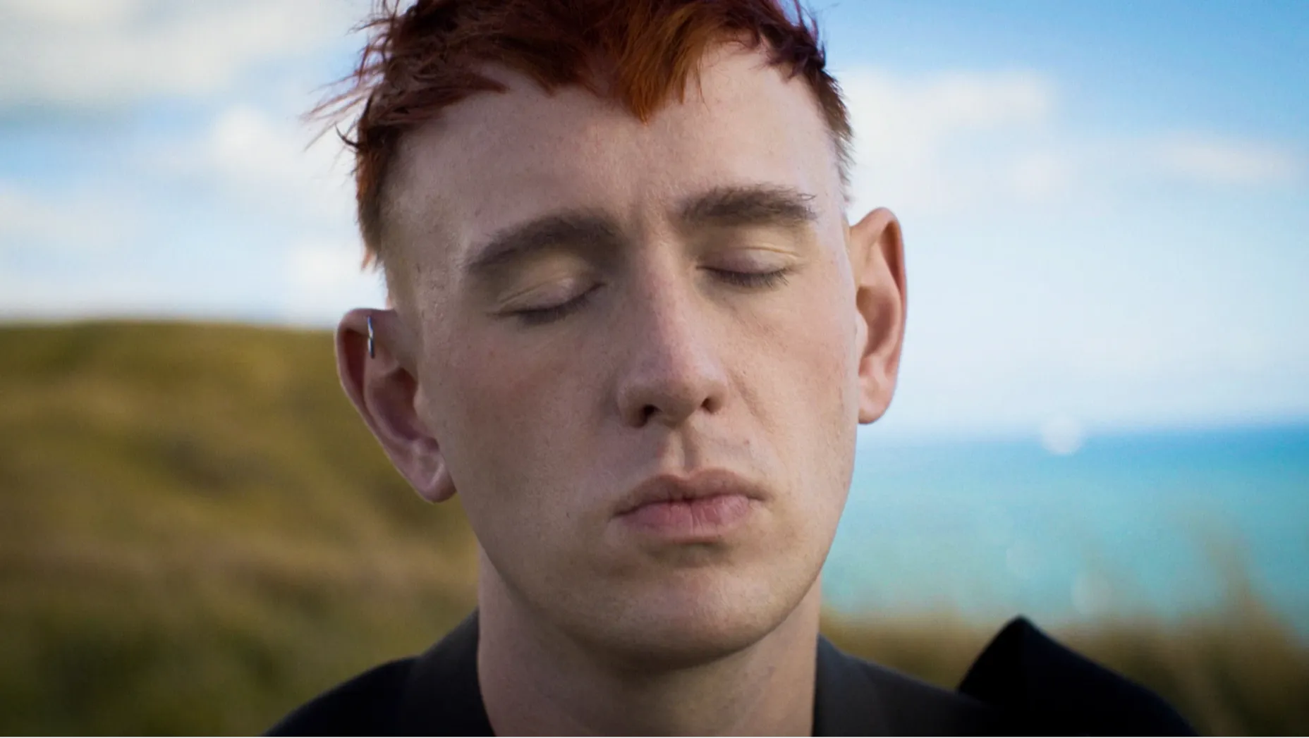 A portrait photograph of musician Patrick Wolf