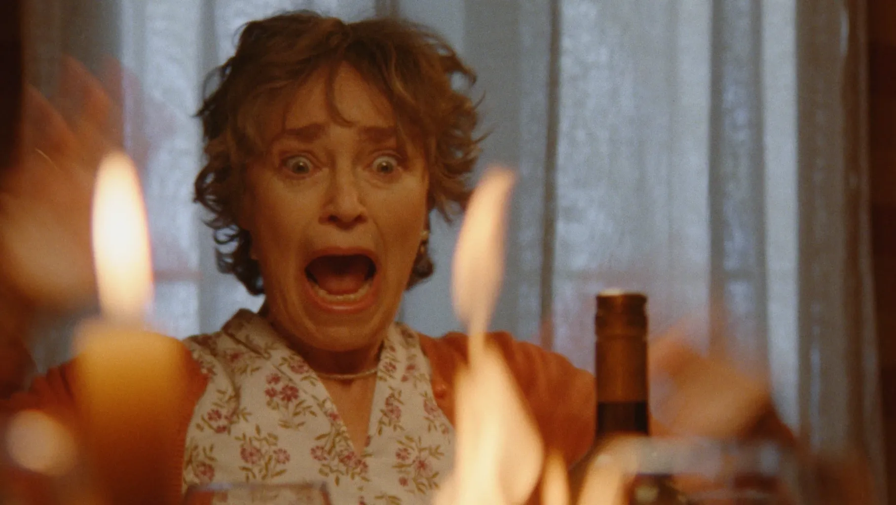 A woman recoils in shock