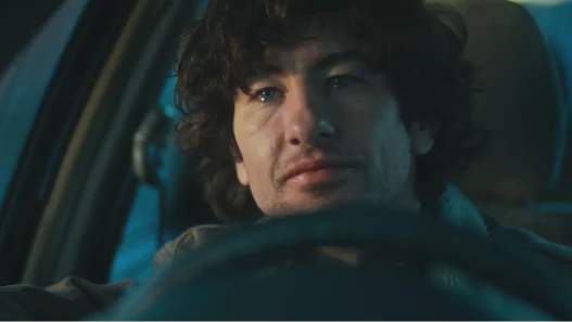 Brown-haired, blue-eyed man in his thirties gazes to the left of frame with tears in his eyes as he is moved by positive emotion