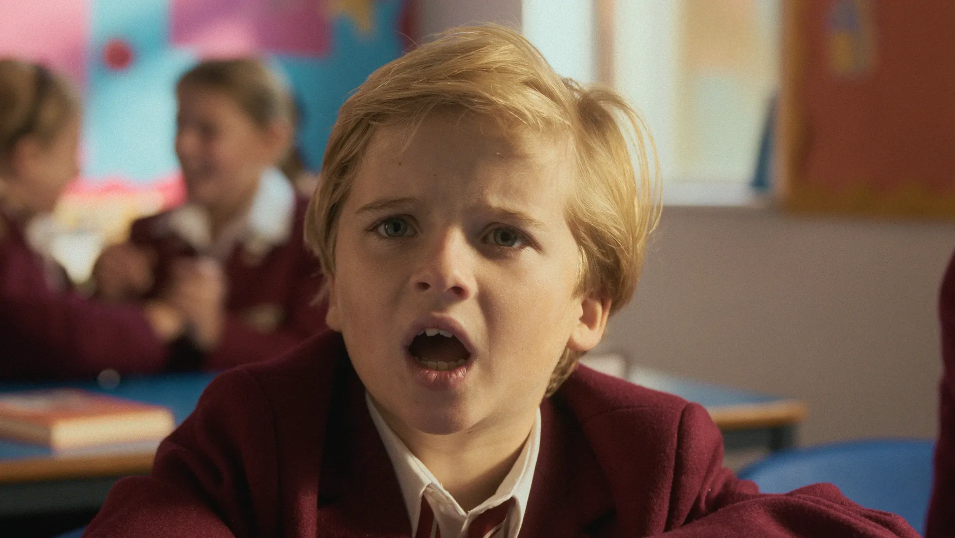 A young boy looks annoyed.