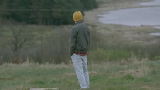 A man looks at at a body of water