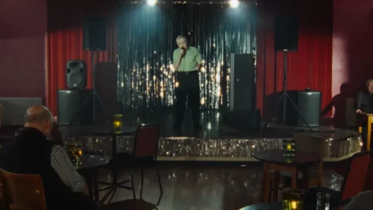 A man is performing a song at a karaoke bar.
