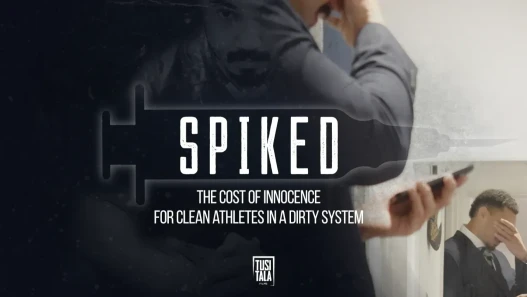 A man, Chris Vui, in a suit looks at his phones and hold his head. There is an overlay photo of him in rugby kit looking at the camera. The title "Spiked" sits inside an injecting seringe