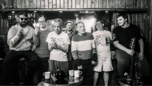 Seven men, members of Ultimate Thunder, stand together