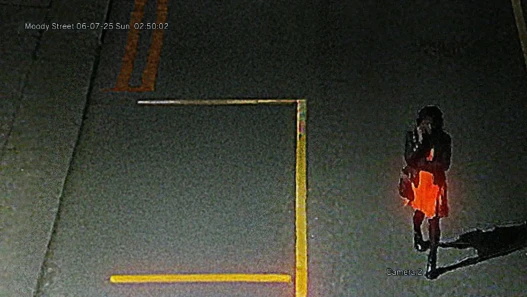 'Carolyn' walking alone down a deserted street at night